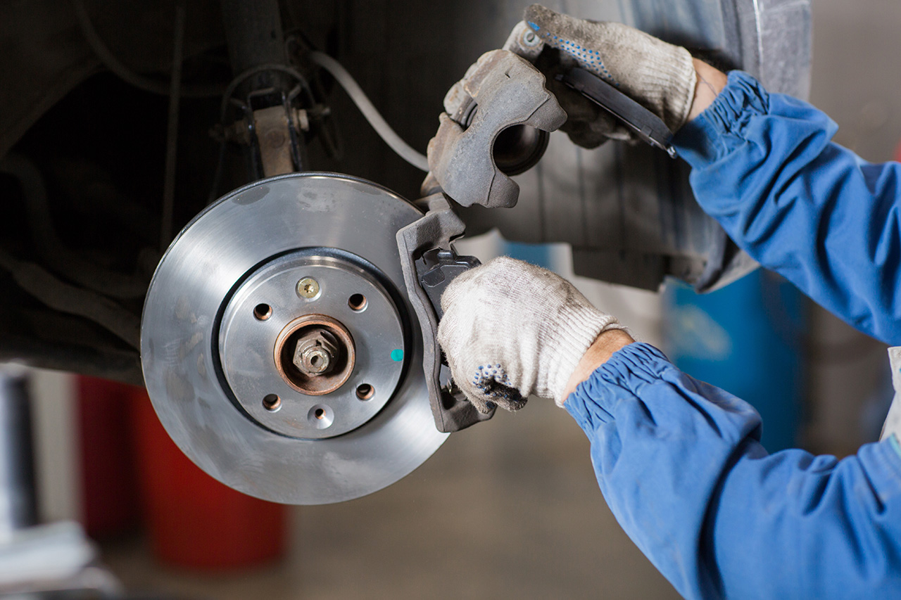 Technician performing Chevrolet brake service