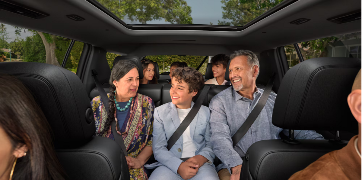 Family sitting inside the 2027 Chevrolet Traverse